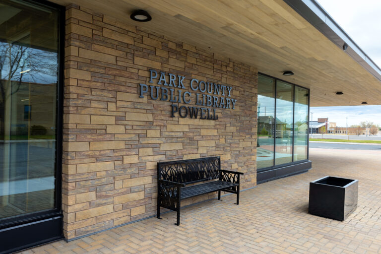 Finished exterior entrance showcasing masonry, wood soffit, and architectural glazing by Groathouse Construction