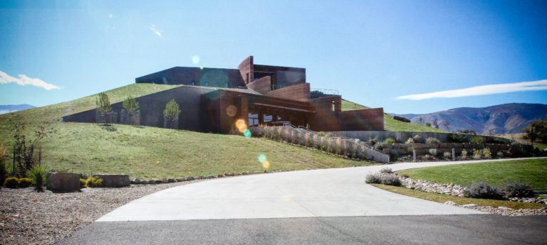 The Brinton Museum exterior with landscaped entrance and curved driveway in Big Horn, Wyoming.